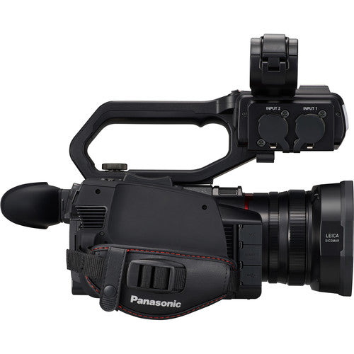 Side view Panasonic HC-X2000 UHD Camcorder, showing the top handle with covered inputs, ideal for event & wedding videography