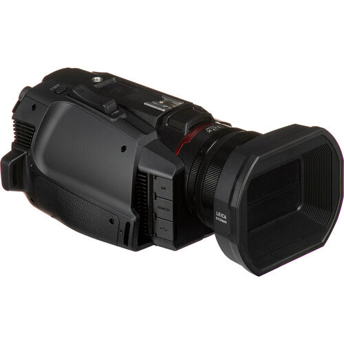 Angled view of the Panasonic HC-X2000 UHD Camcorder, showing the camera body and lens, ideal for studio productions.