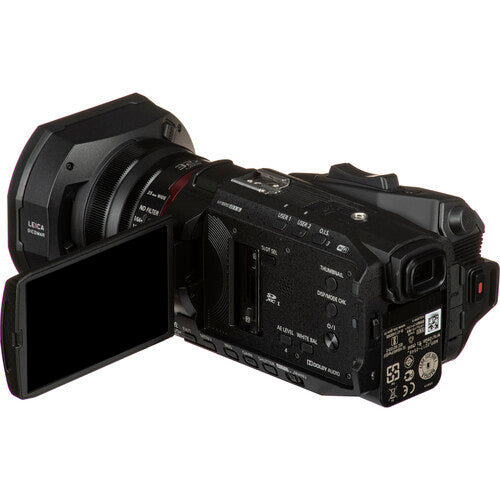 Rear-left angled view of the Panasonic HC-X2000 4K camcorder with LCD screen extended, ideal for ENG and studio productions.