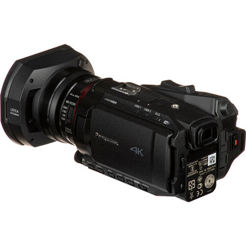 Rear-left angled view of the Panasonic HC-X2000 4K camcorder with LCD screen closed, ideal for multi-camera live broadcasts.